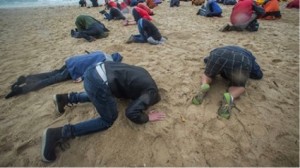 Head in the sand protest at Wellington’s Oriental Bay, December 2014. Photo: Stuff.co.nz